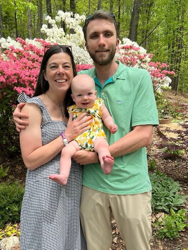 Heather, Niki, Zenta in front of flowers